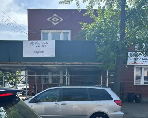 a front view of a house with parking area