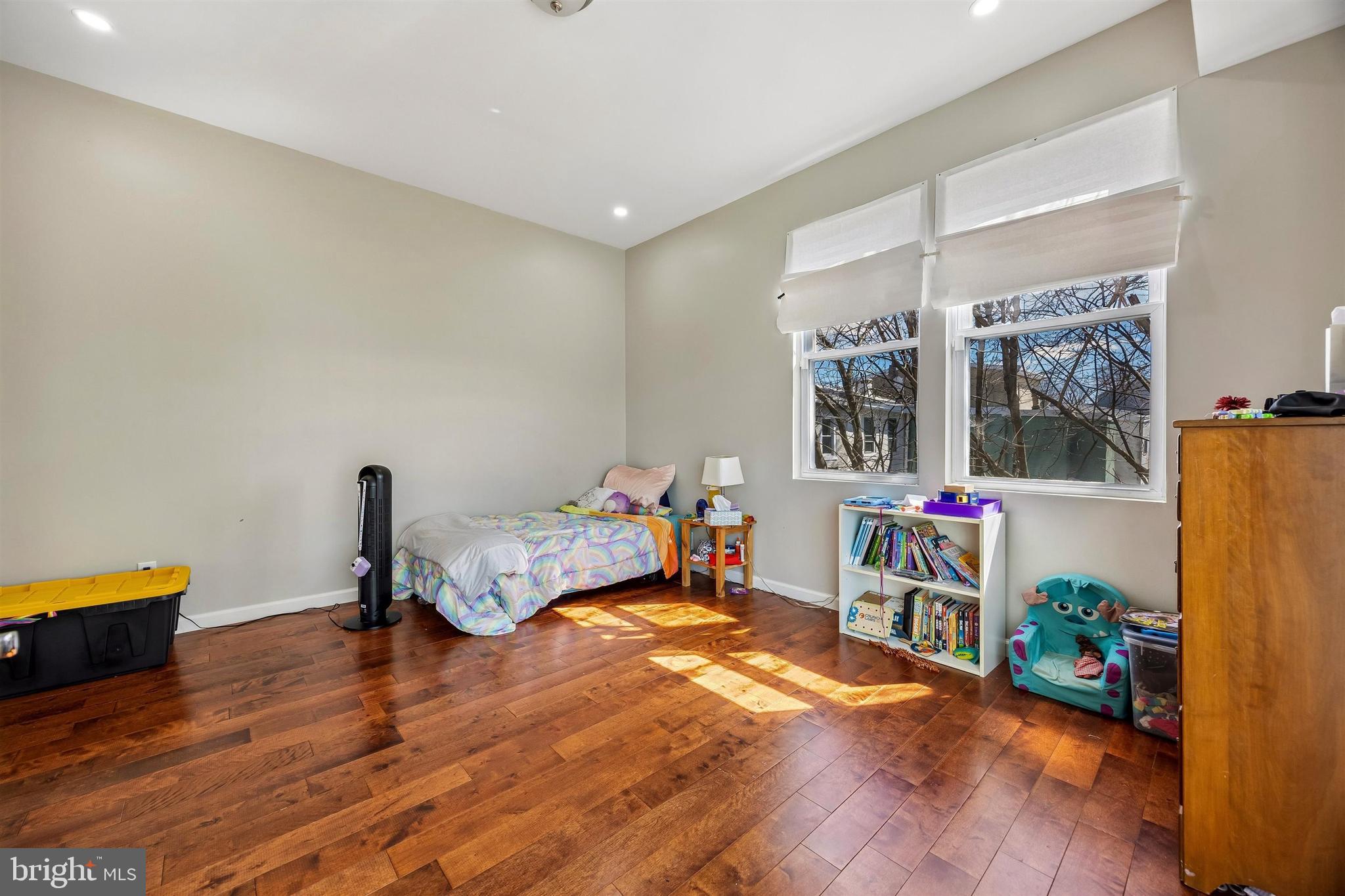 217 Grape Street Philadelphia, PA 19128 - Photo 12 of 27 a bedroom with furniture and a wooden floor