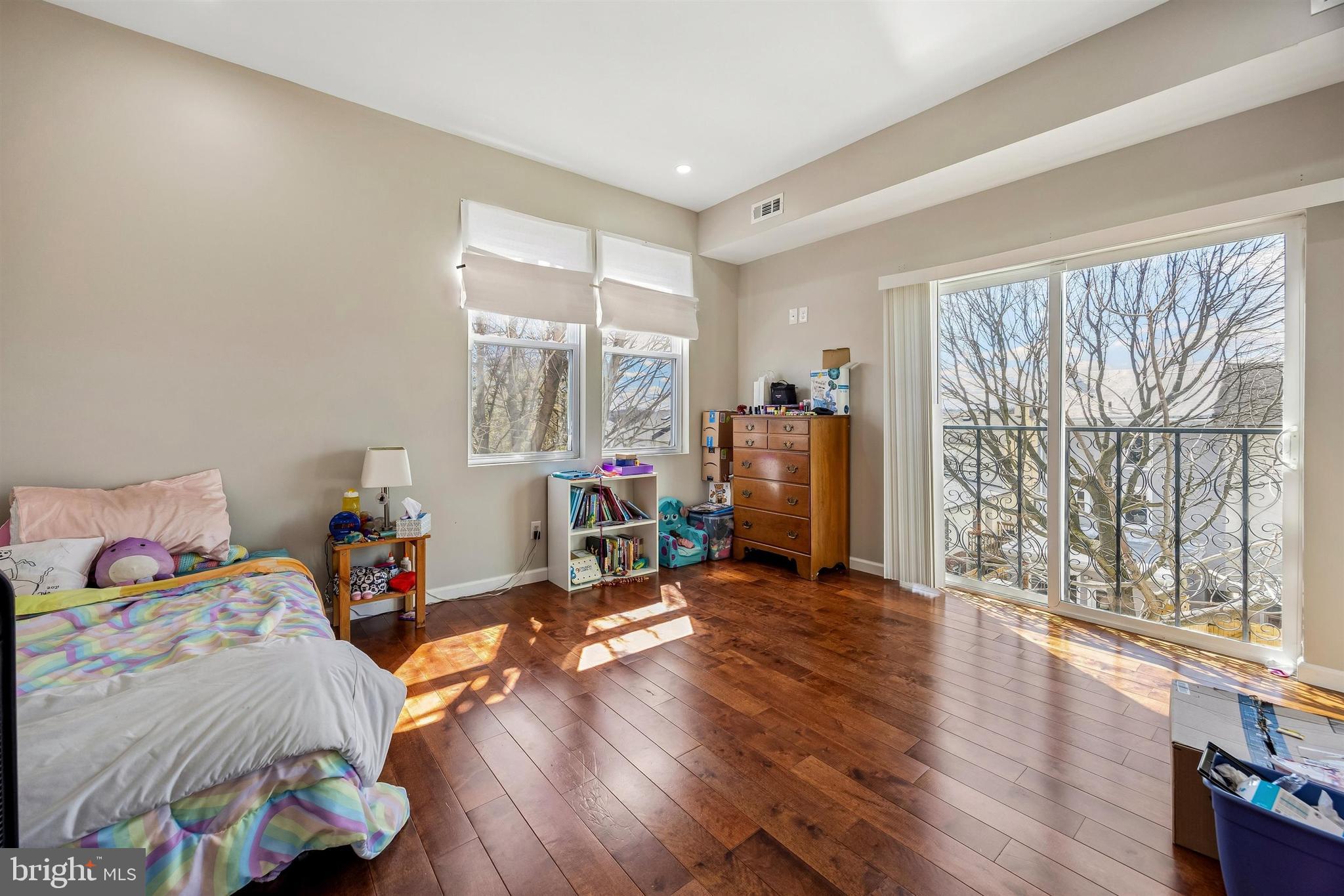 217 Grape Street Philadelphia, PA 19128 - Photo 13 of 27 a bed room with a bed and a large window