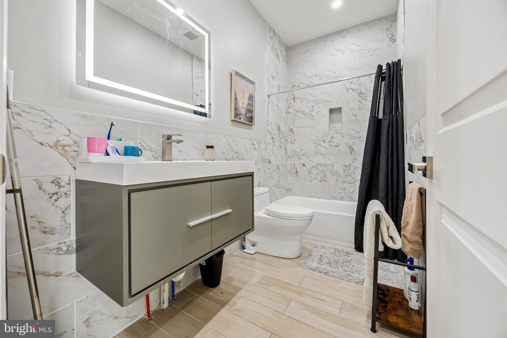 217 Grape Street Philadelphia, PA 19128 - Photo 14 of 27 a bathroom with a sink toilet and shower