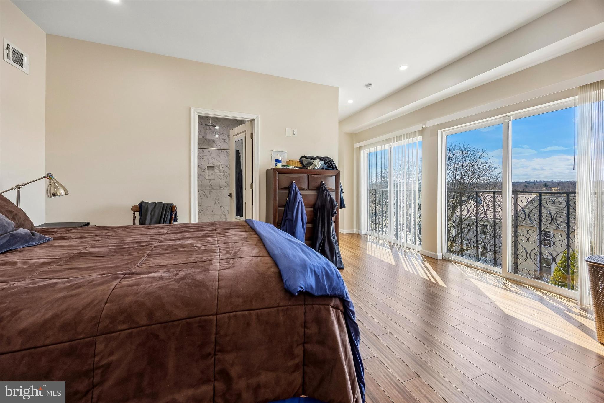 217 Grape Street Philadelphia, PA 19128 - Photo 15 of 27 a bed room with a bed and a large window