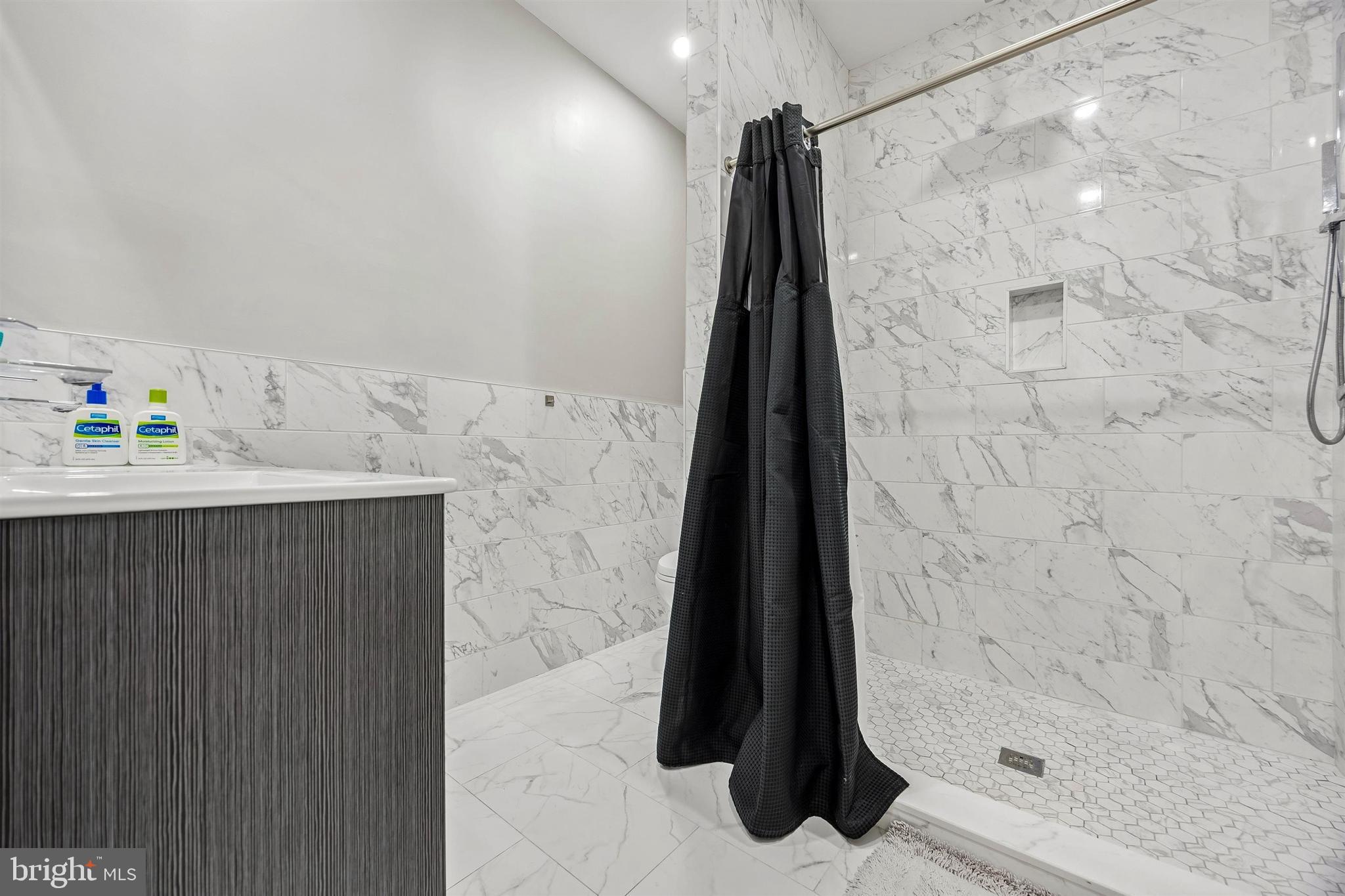 217 Grape Street Philadelphia, PA 19128 - Photo 16 of 27 a bathroom with a shower and a sink