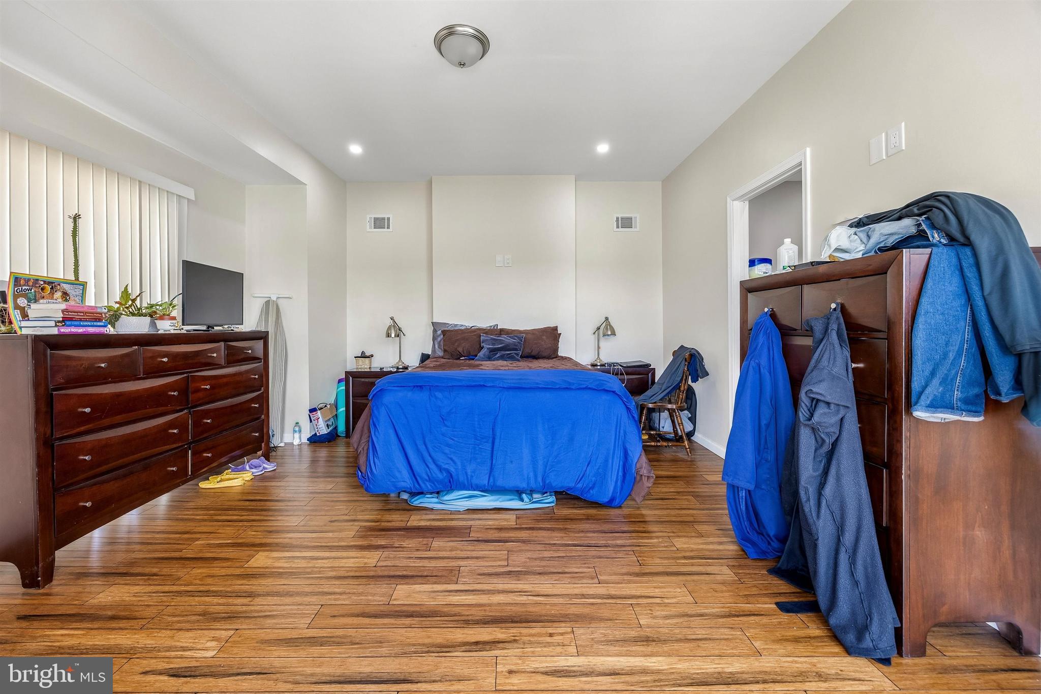 217 Grape Street Philadelphia, PA 19128 - Photo 18 of 27 a spacious bedroom with a bed and a closet