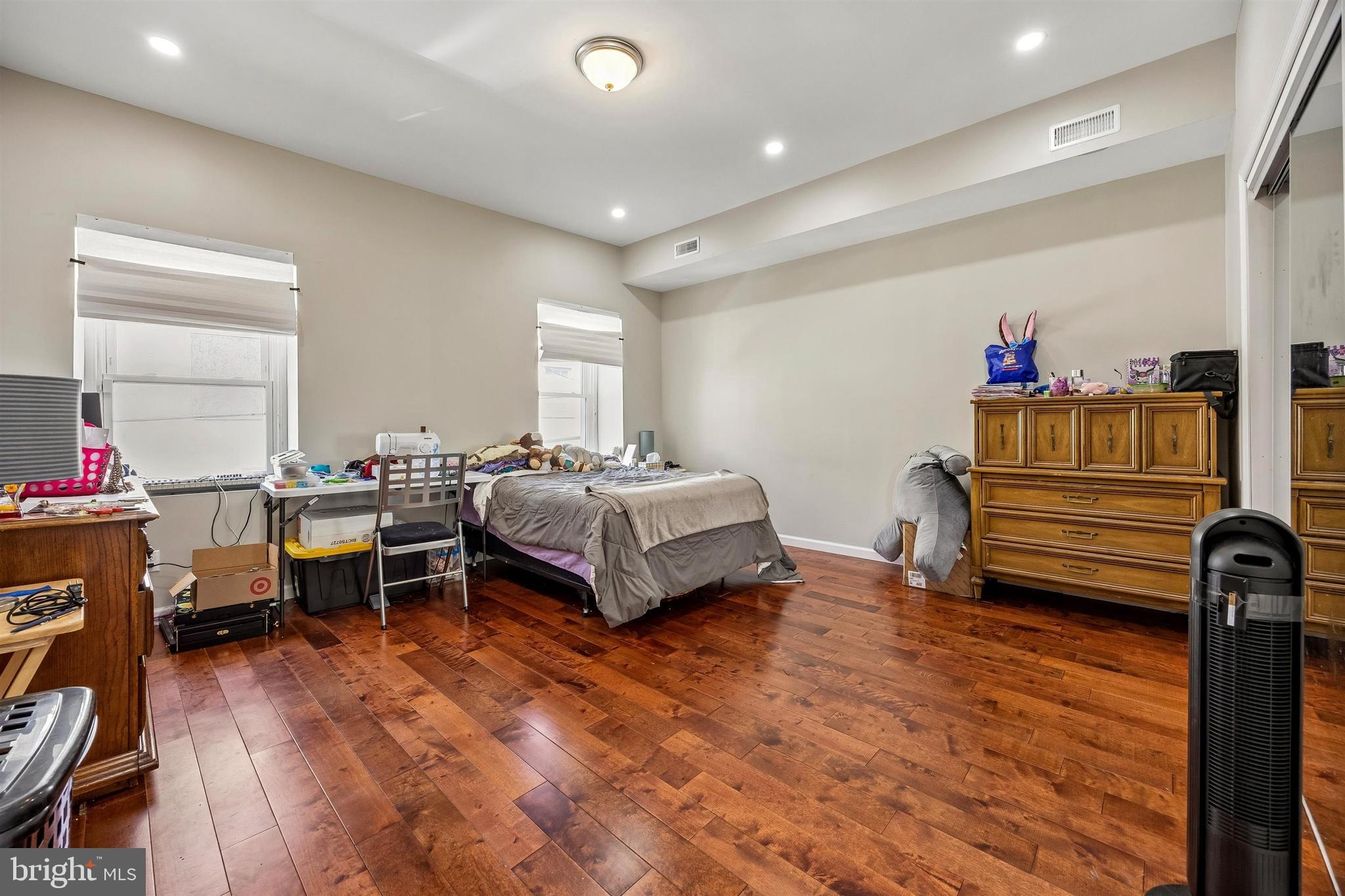 217 Grape Street Philadelphia, PA 19128 - Photo 9 of 27 a bedroom with furniture and a wooden floor