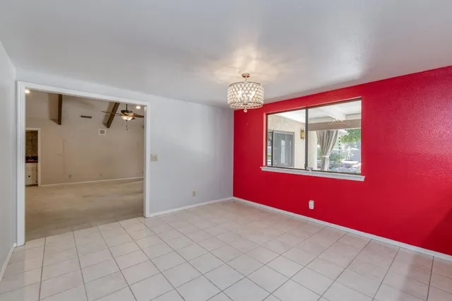 an empty room with closet and a bathroom