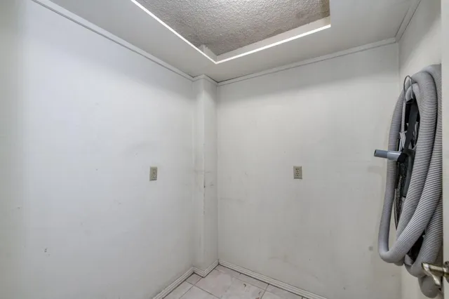 a view of a backyard with sitting area and garden