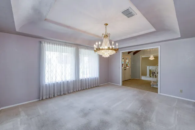 a view of a swimming pool with a yard