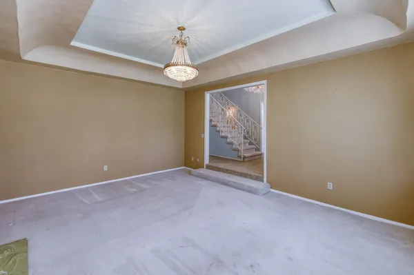 a front view of a house with a garden and plants
