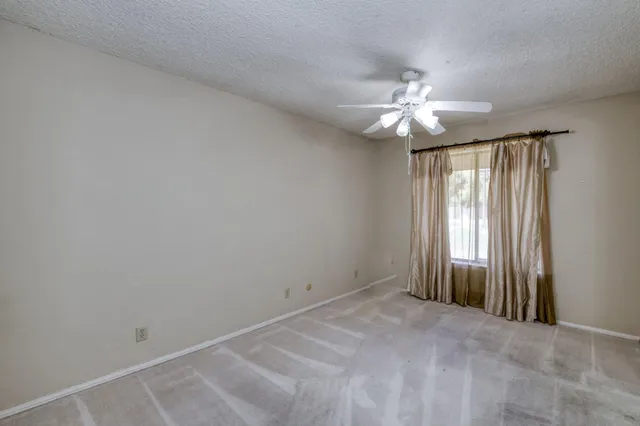 a house with trees in the background