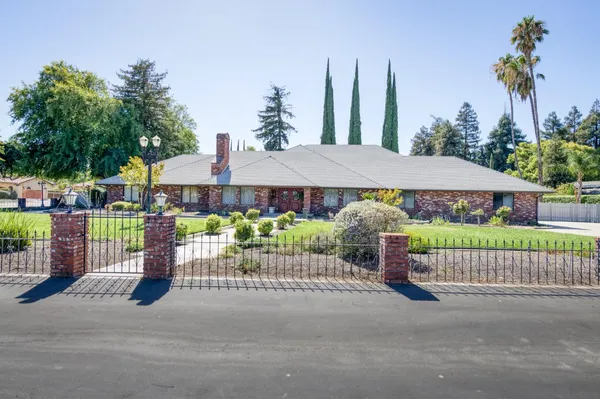 a view of an empty room and fire place