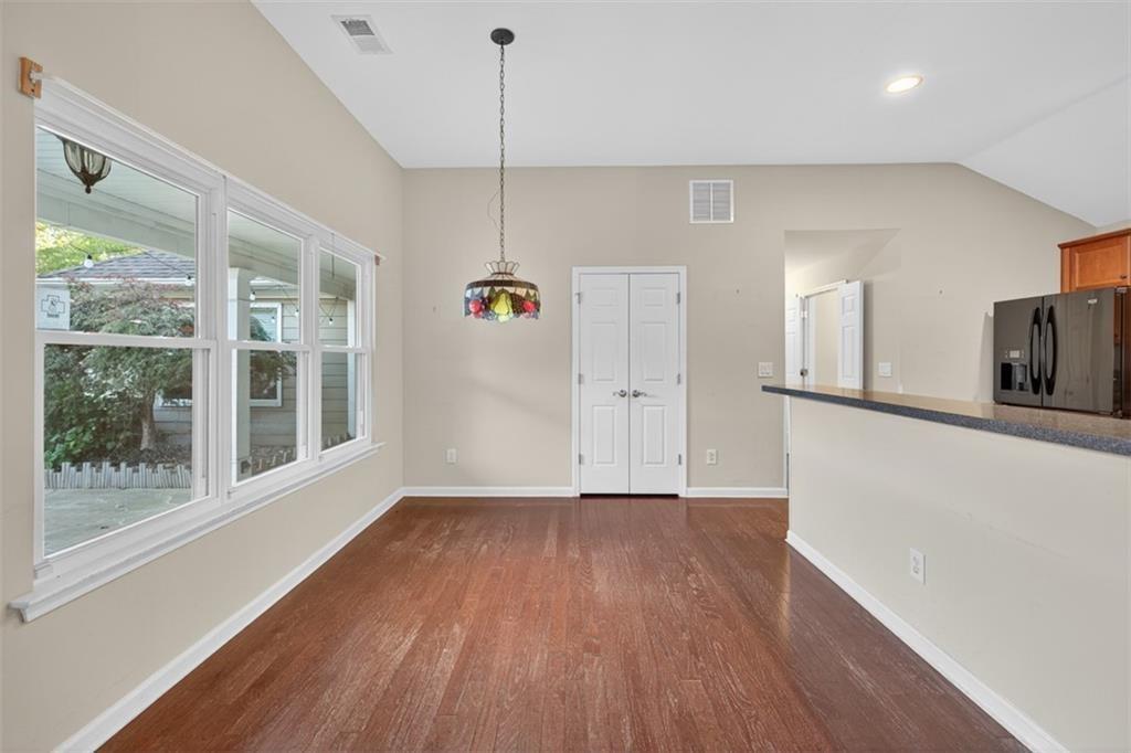 164 Cottage Club Drive Locust Grove, GA 30248 - Photo 22 of 56 a view of empty room with wooden floor and fan