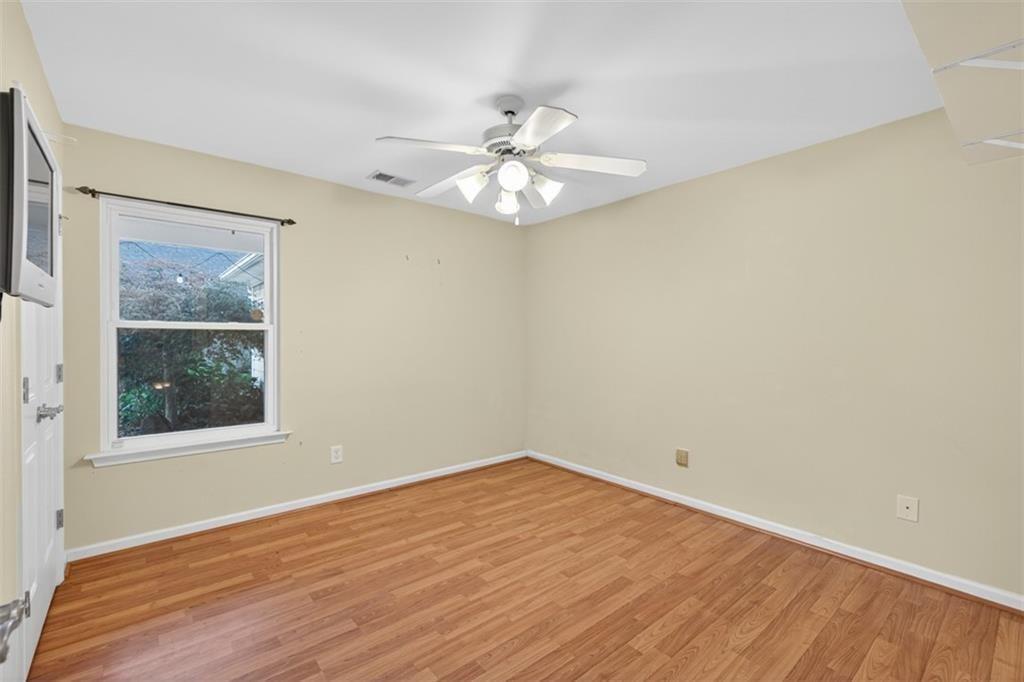 164 Cottage Club Drive Locust Grove, GA 30248 - Photo 28 of 56 wooden floor in an empty room with a window
