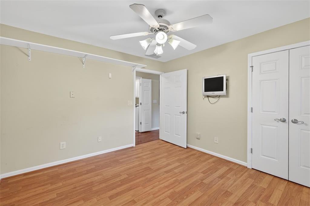 164 Cottage Club Drive Locust Grove, GA 30248 - Photo 29 of 56 a view of an empty room with wooden floor