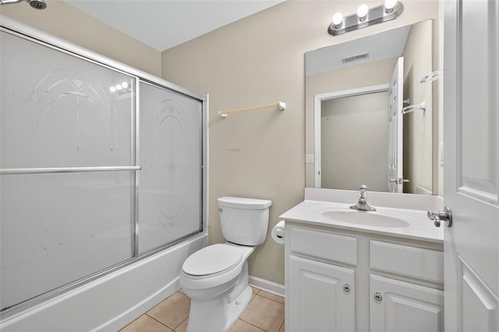 164 Cottage Club Drive Locust Grove, GA 30248 - Photo 32 of 56 a bathroom with a sink a toilet and shower