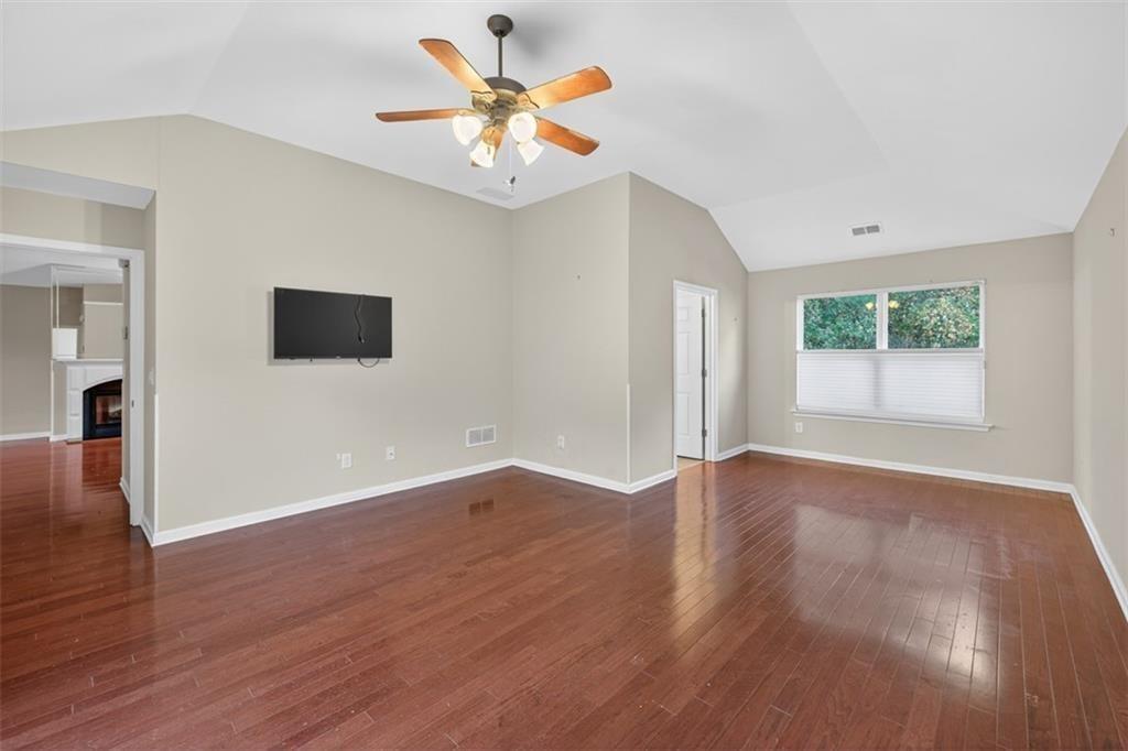 164 Cottage Club Drive Locust Grove, GA 30248 - Photo 34 of 56 wooden floor in an empty room with a window