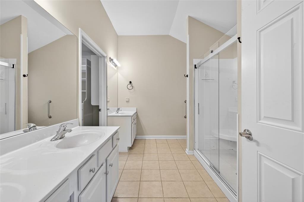 164 Cottage Club Drive Locust Grove, GA 30248 - Photo 38 of 56 a bathroom with a sink and a mirror