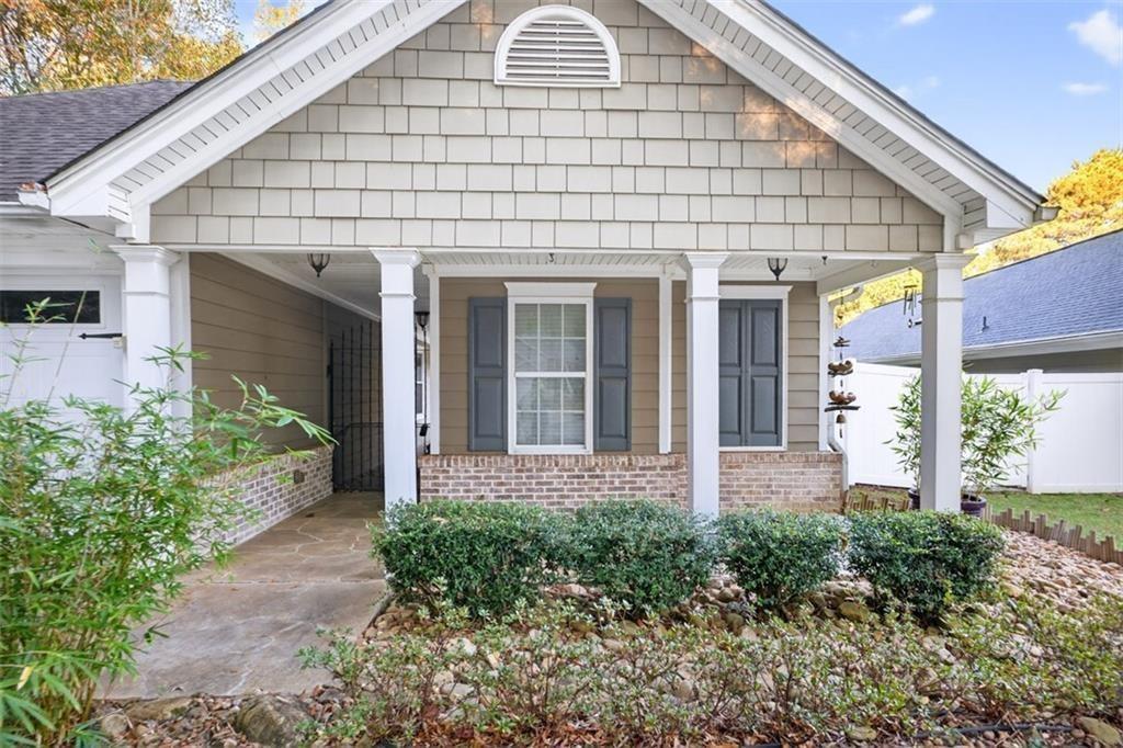 164 Cottage Club Drive Locust Grove, GA 30248 - Photo 4 of 56 a front view of a house with a garden