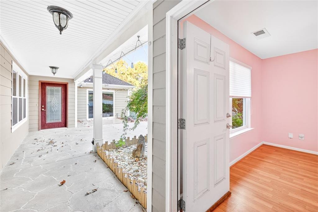 164 Cottage Club Drive Locust Grove, GA 30248 - Photo 43 of 56 a view of an entryway with wooden floor and door