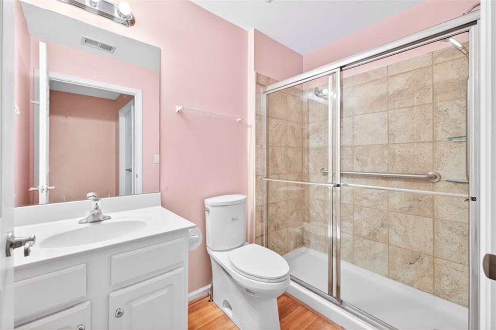 164 Cottage Club Drive Locust Grove, GA 30248 - Photo 46 of 56 a bathroom with a sink toilet and shower