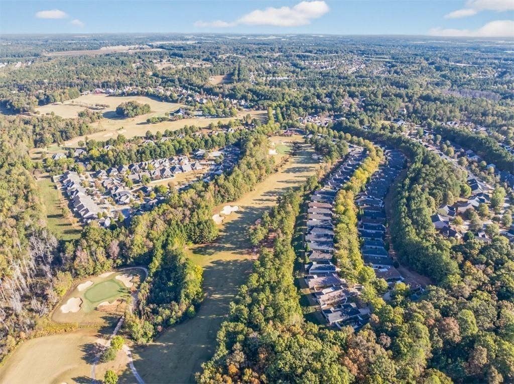 164 Cottage Club Drive Locust Grove, GA 30248 - Photo 50 of 56 an aerial view of residential houses with outdoor space