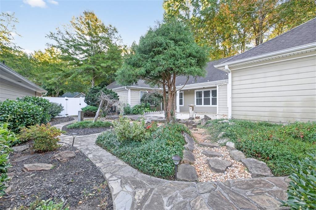 164 Cottage Club Drive Locust Grove, GA 30248 - Photo 10 of 56 a front view of a house with garden