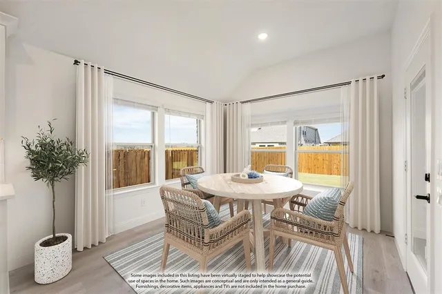 a large kitchen with stainless steel appliances a large counter top