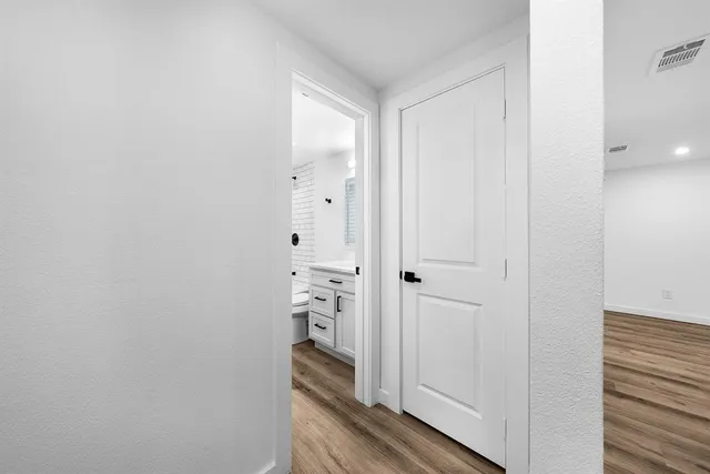 a view of a bathroom from the hallway
