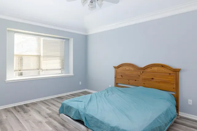 a bedroom with a bed and window