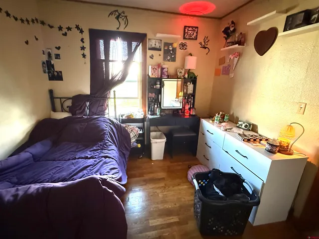 a bed room with a bed and a couch