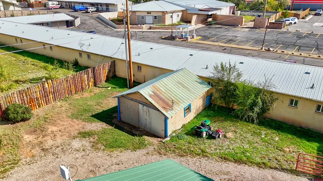 a view of a backyard with sitting area