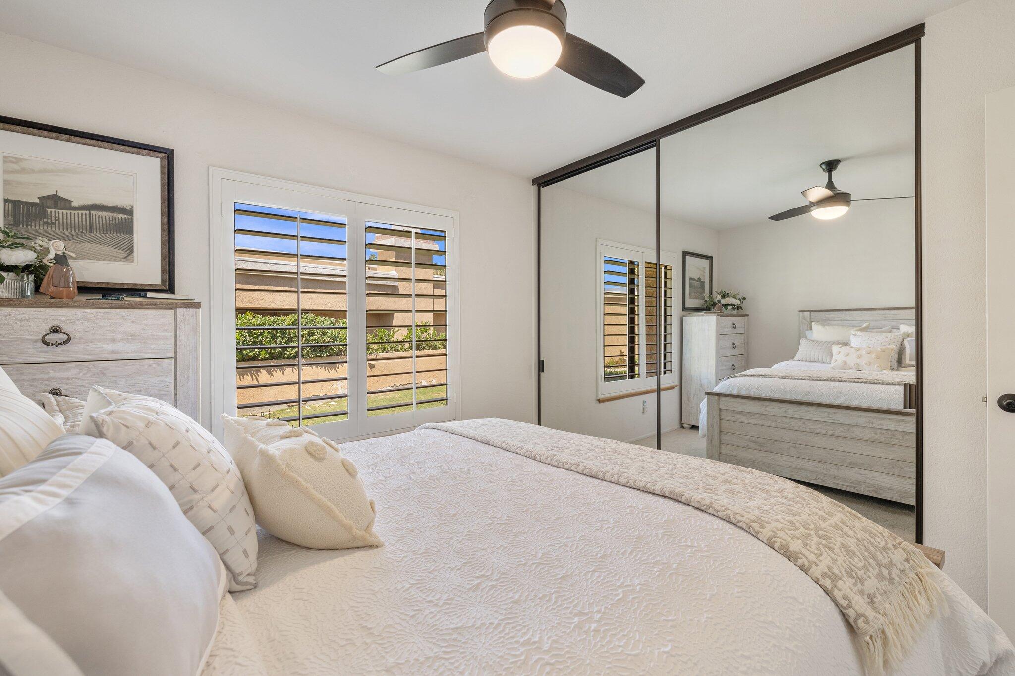 73750 Calle Bisque Palm Desert, CA 92260 - Photo 21 of 40 a bedroom with a large bed and a window