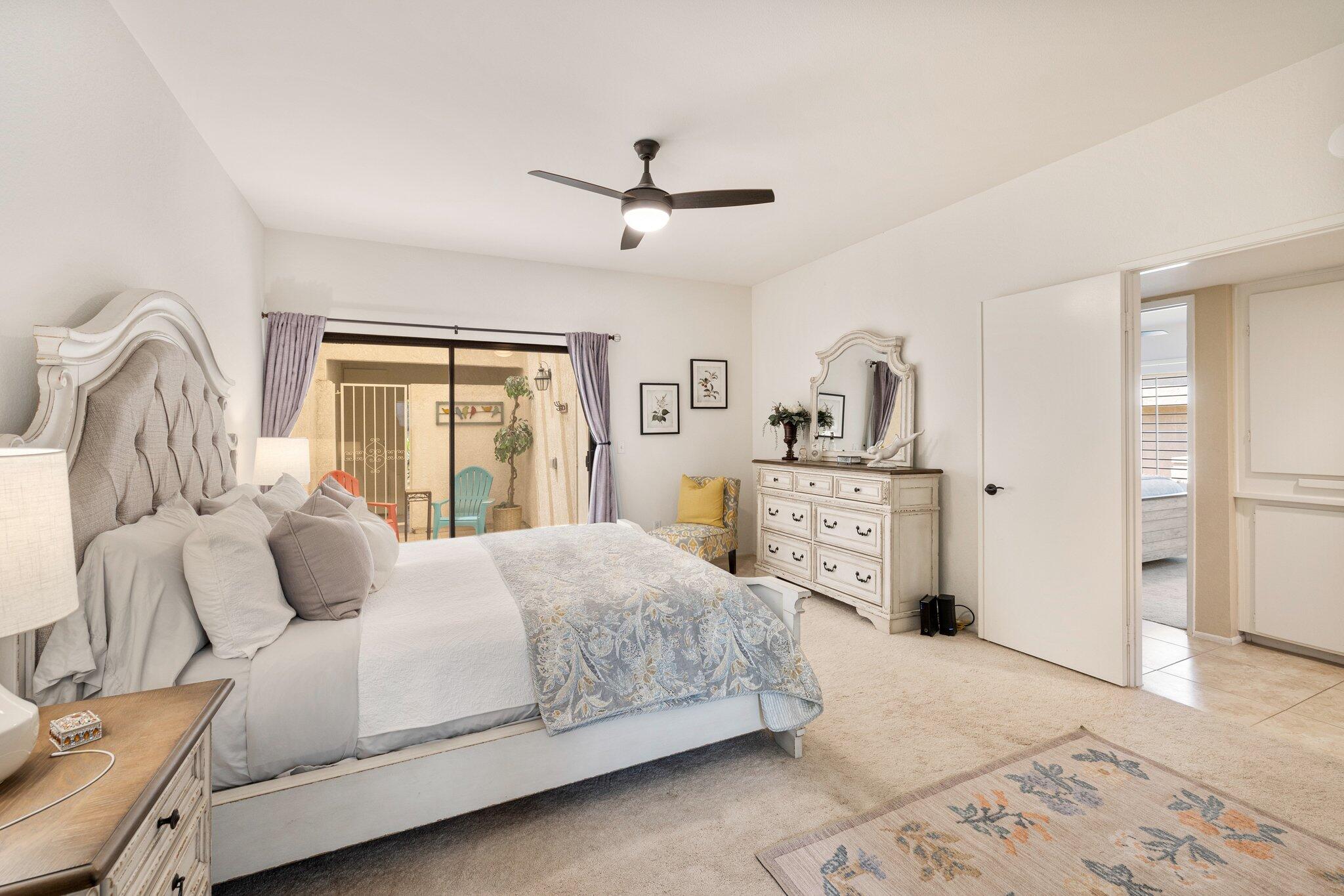 73750 Calle Bisque Palm Desert, CA 92260 - Photo 23 of 40 a bedroom with a bed and a couch