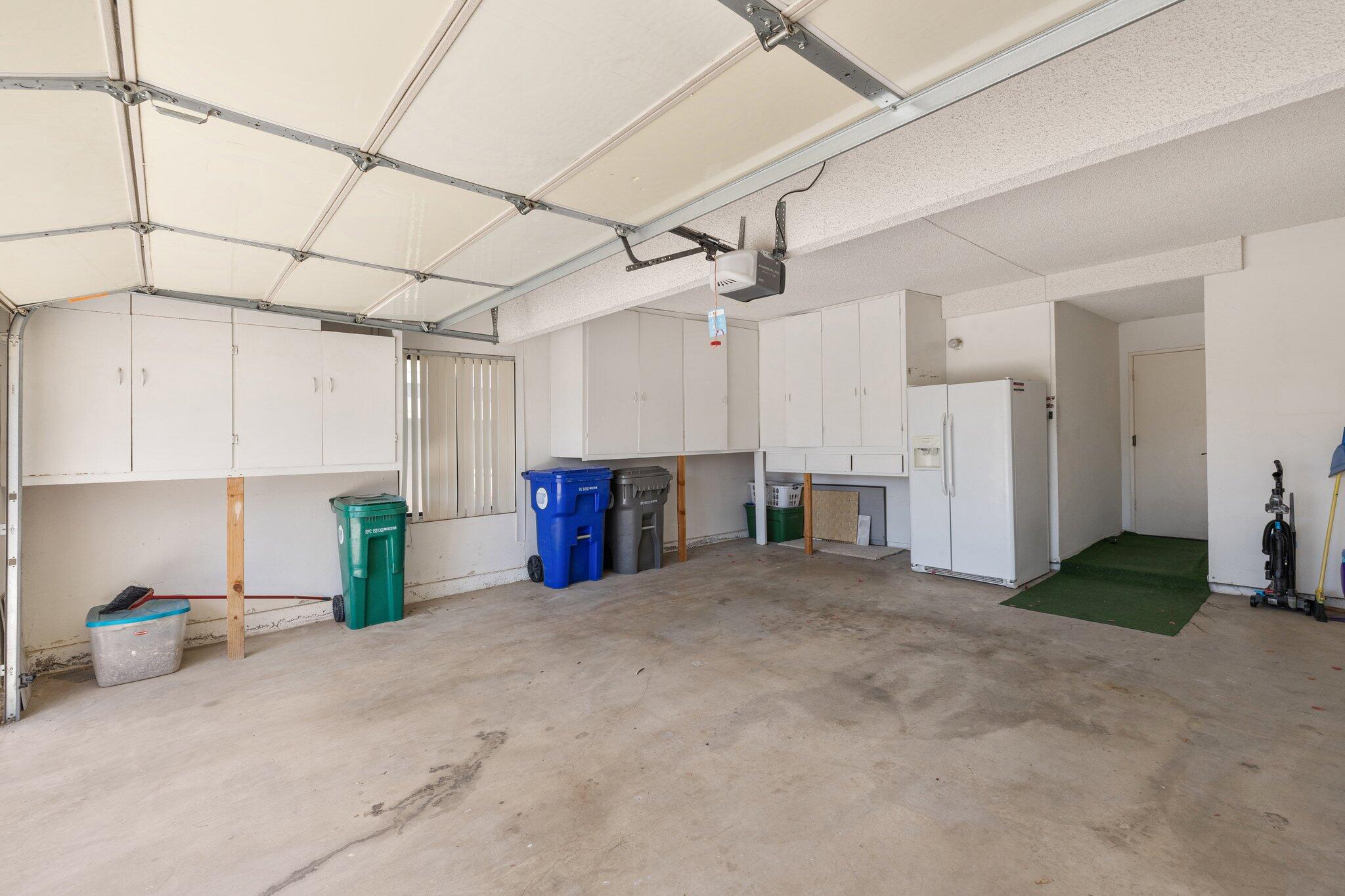 73750 Calle Bisque Palm Desert, CA 92260 - Photo 33 of 40 a view of a kitchen with refrigerator and cabinets