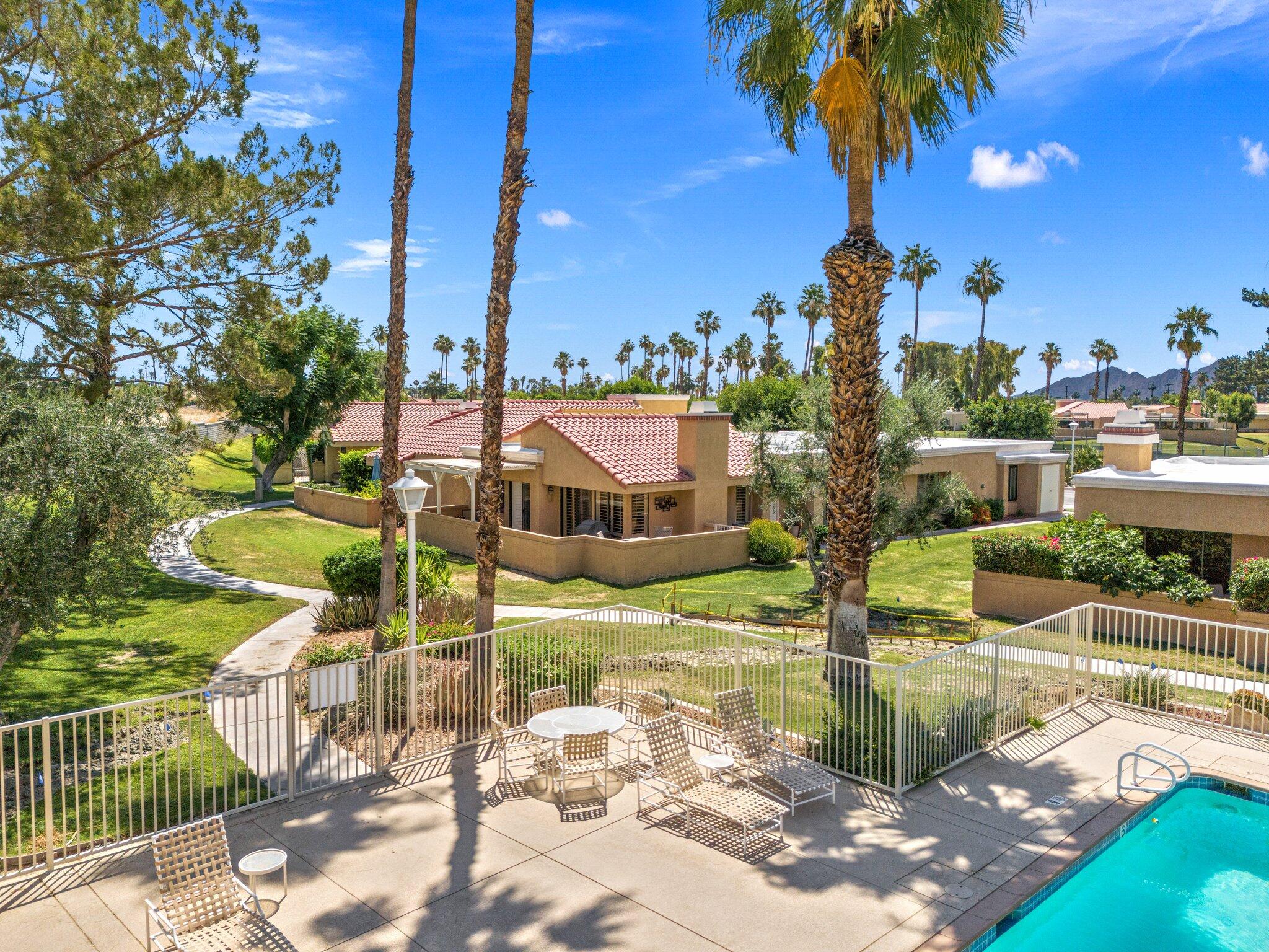 73750 Calle Bisque Palm Desert, CA 92260 - Photo 34 of 40 a view of a lake from a building