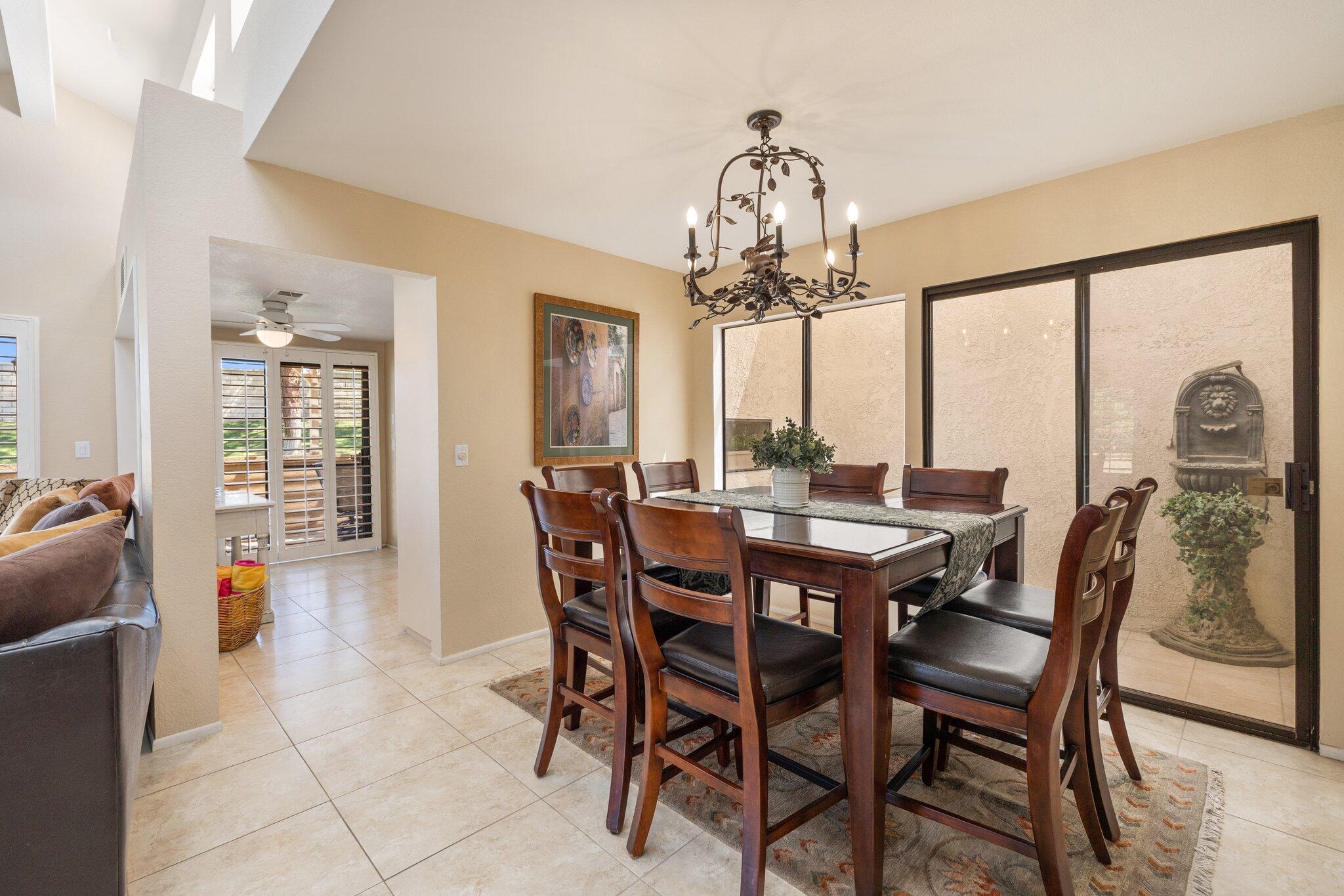 73750 Calle Bisque Palm Desert, CA 92260 - Photo 9 of 40 a view of a dining room with furniture window and outside view