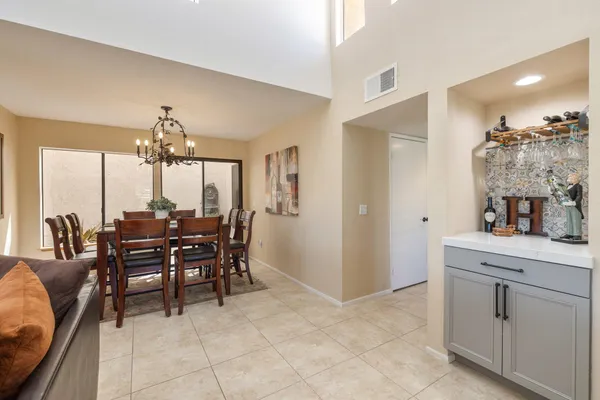a dining room with furniture and window