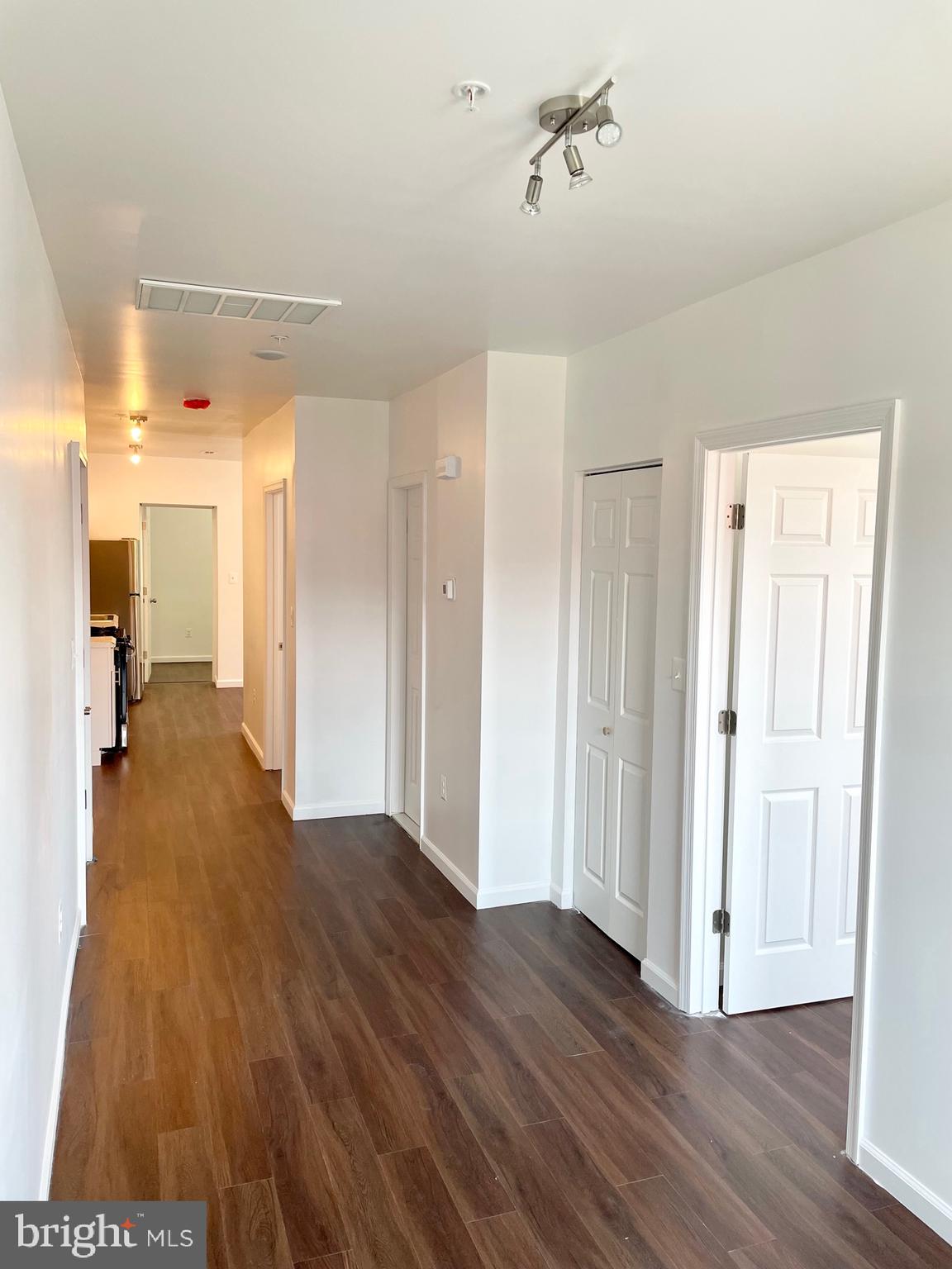 1838 C Street Southeast, Unit 1 Washington, DC 20003 - Photo 6 of 6 a view of a hallway with wooden floor