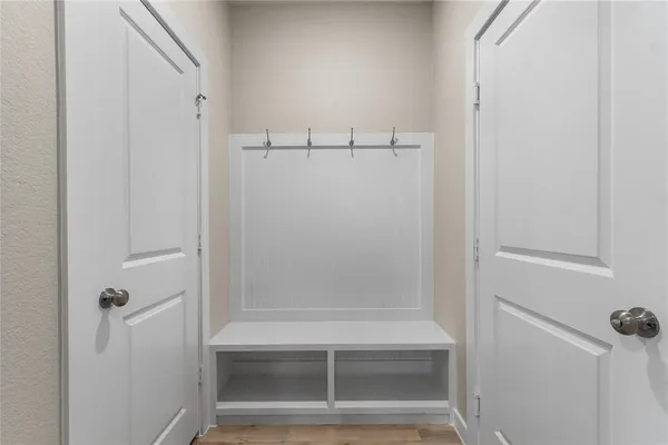 a bathroom with a glass shower door