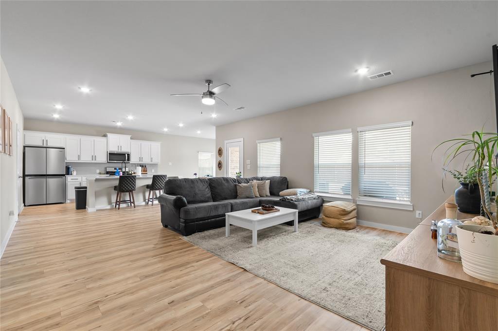 797 Vineyard Way Forney, TX 75126 - Photo 2 of 24 a living room with furniture and a large window