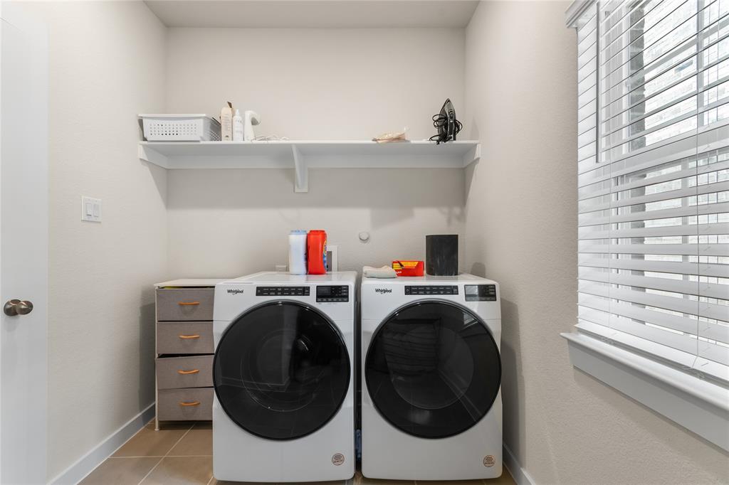 797 Vineyard Way Forney, TX 75126 - Photo 22 of 24 a utility room with dryer and washer