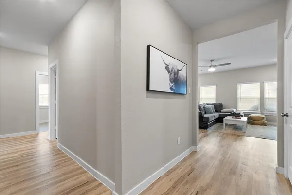 a area with wooden floor and furniture