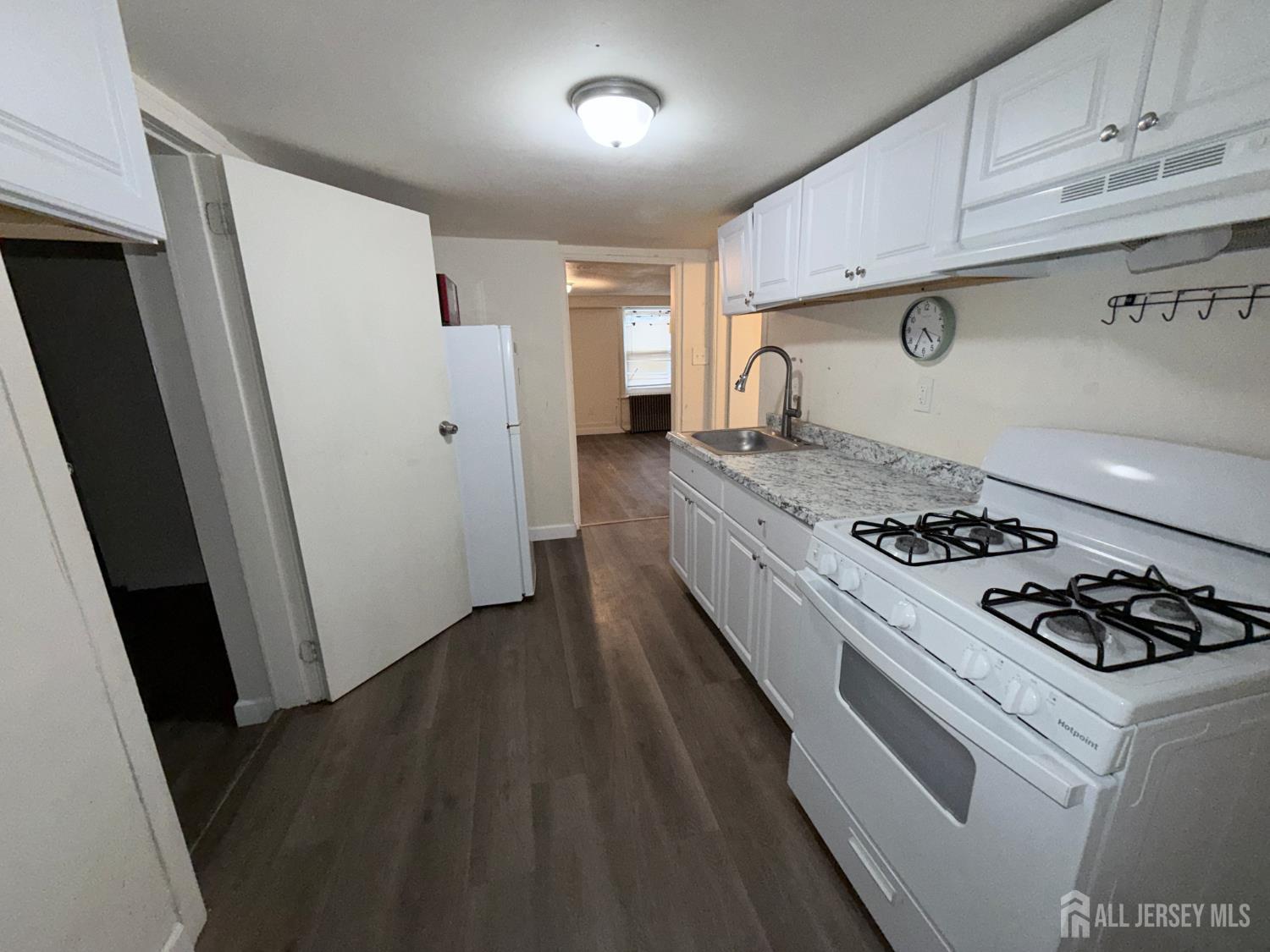 41 Atlantic Street Keyport, NJ 07735 - Photo 32 of 48 a kitchen with a stove and a refrigerator