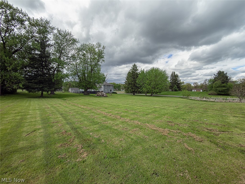 13429 West Calla Road Salem, OH 44460 - Photo 25 of 27 Expansive green lawn with mature trees and a distant dwelling