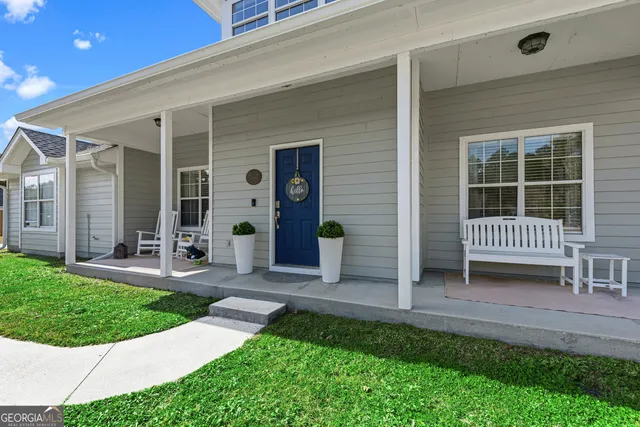 a view of an entryway with a floor to ceiling window