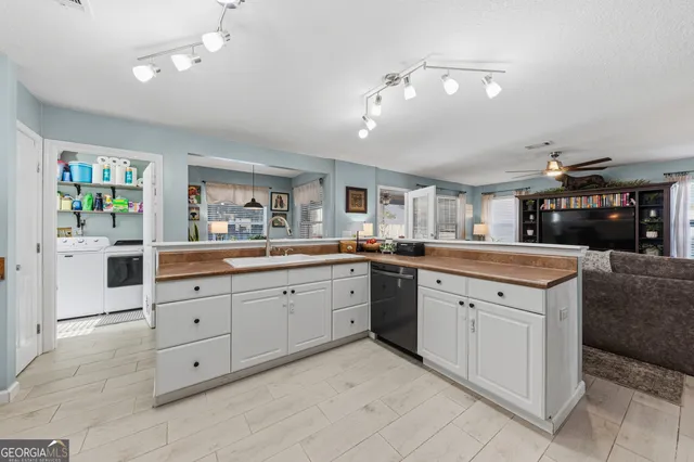 a dining room with a wooden table and chairs