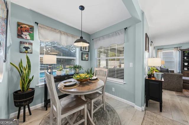 a dining room with furniture and window