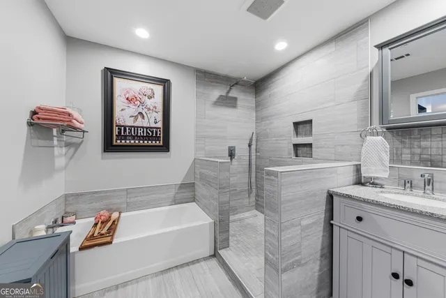 a view of a hallway with furniture and a potted plant
