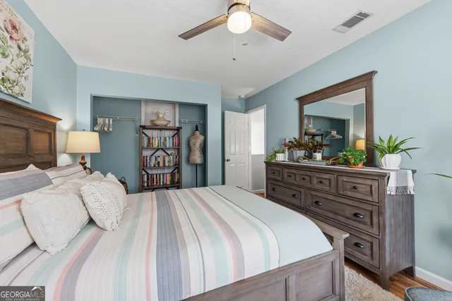a view of a house with swimming pool and sitting area