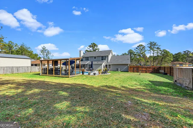 a view of a house with a big yard