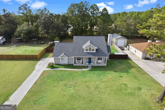 a view of yard with patio